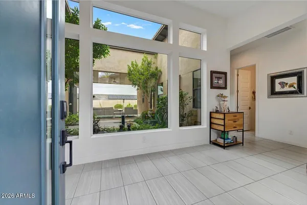 a living room with furniture and a large window