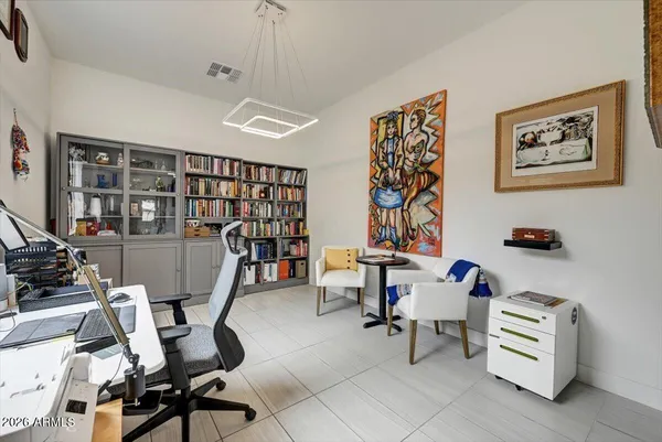 a view of a livingroom with workspace and a couch