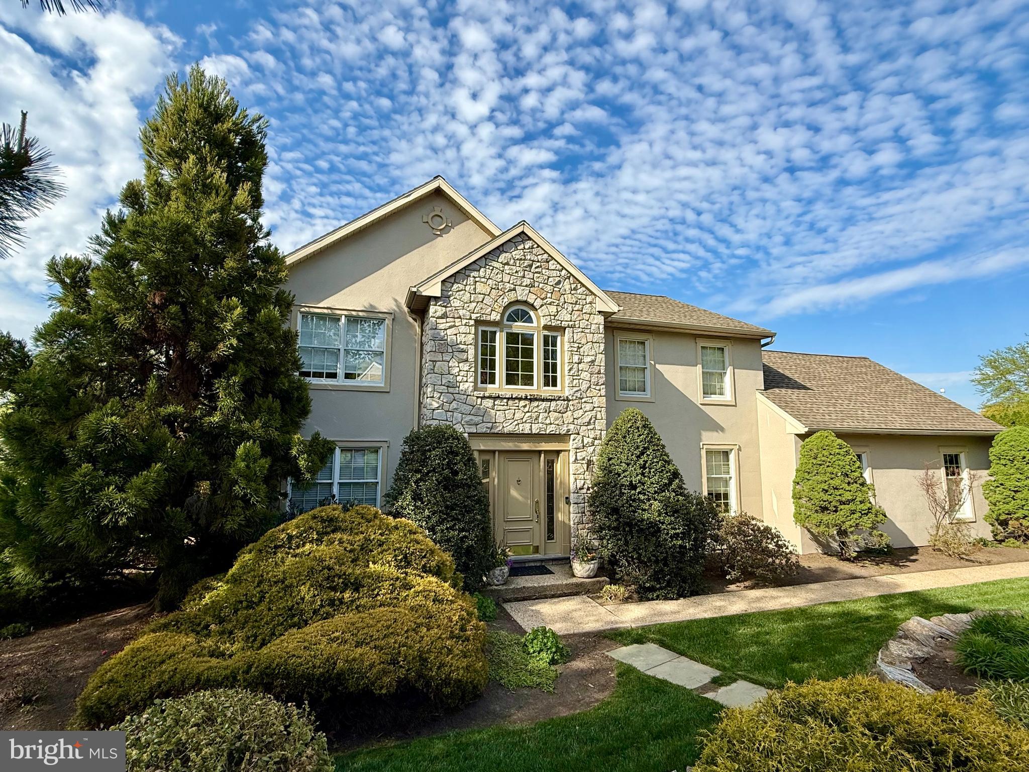 front view of a house with a yard