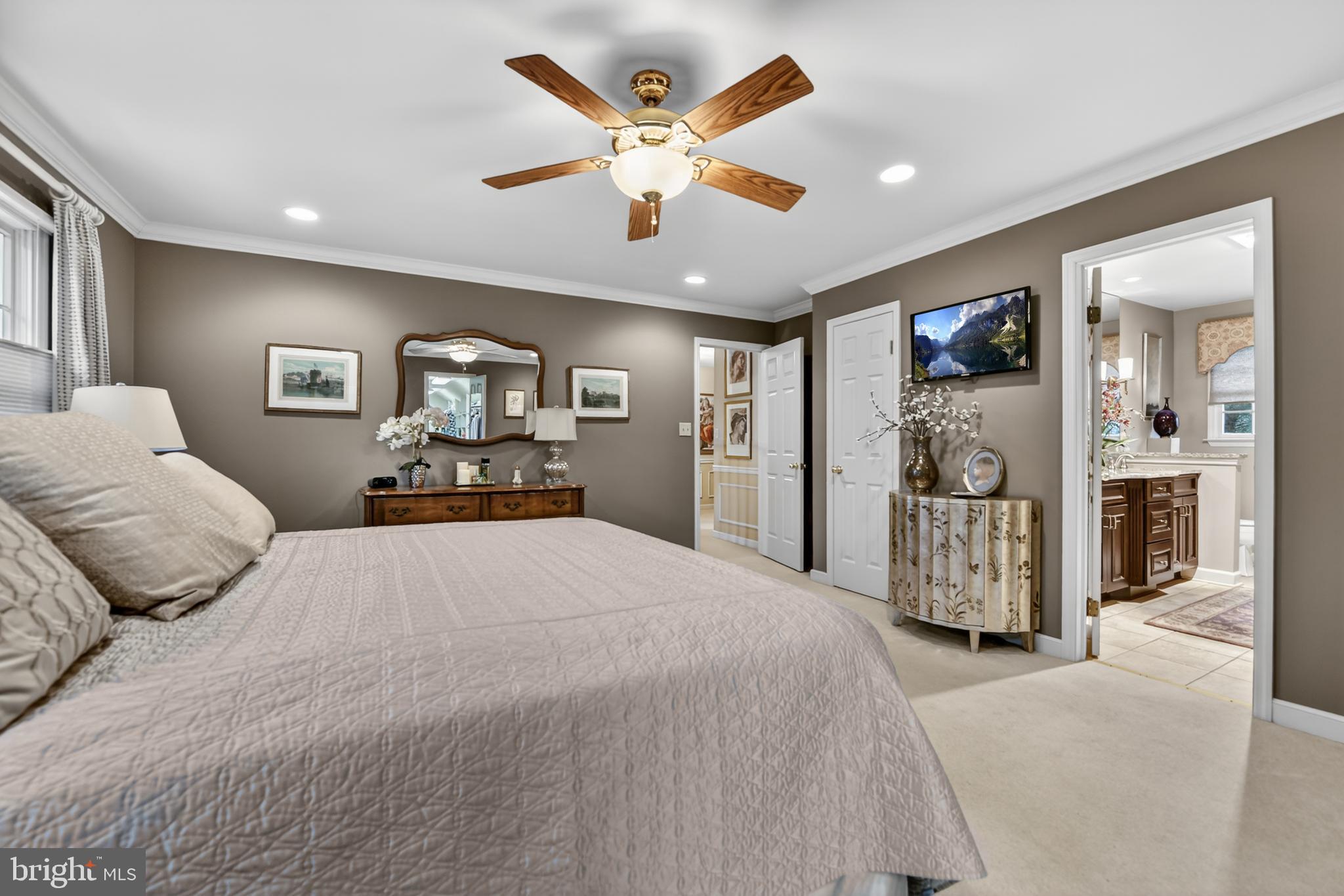 100 Deborah Drive Reading, PA 19610 - Photo 22 of 50 a spacious bedroom with a large bed and ceiling fan