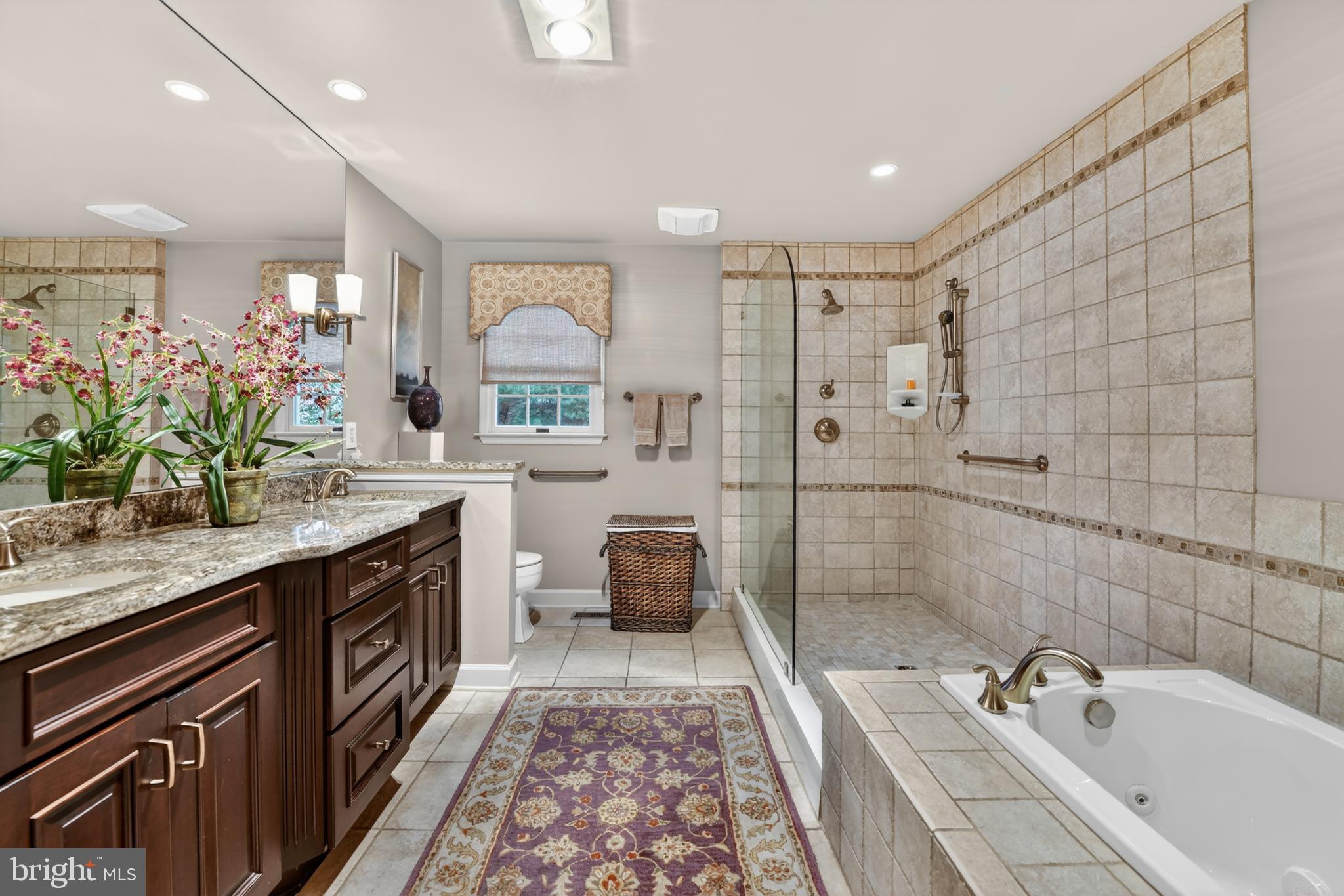 100 Deborah Drive Reading, PA 19610 - Photo 23 of 50 a spacious bathroom with a sink double vanity granite tub shower and a mirror