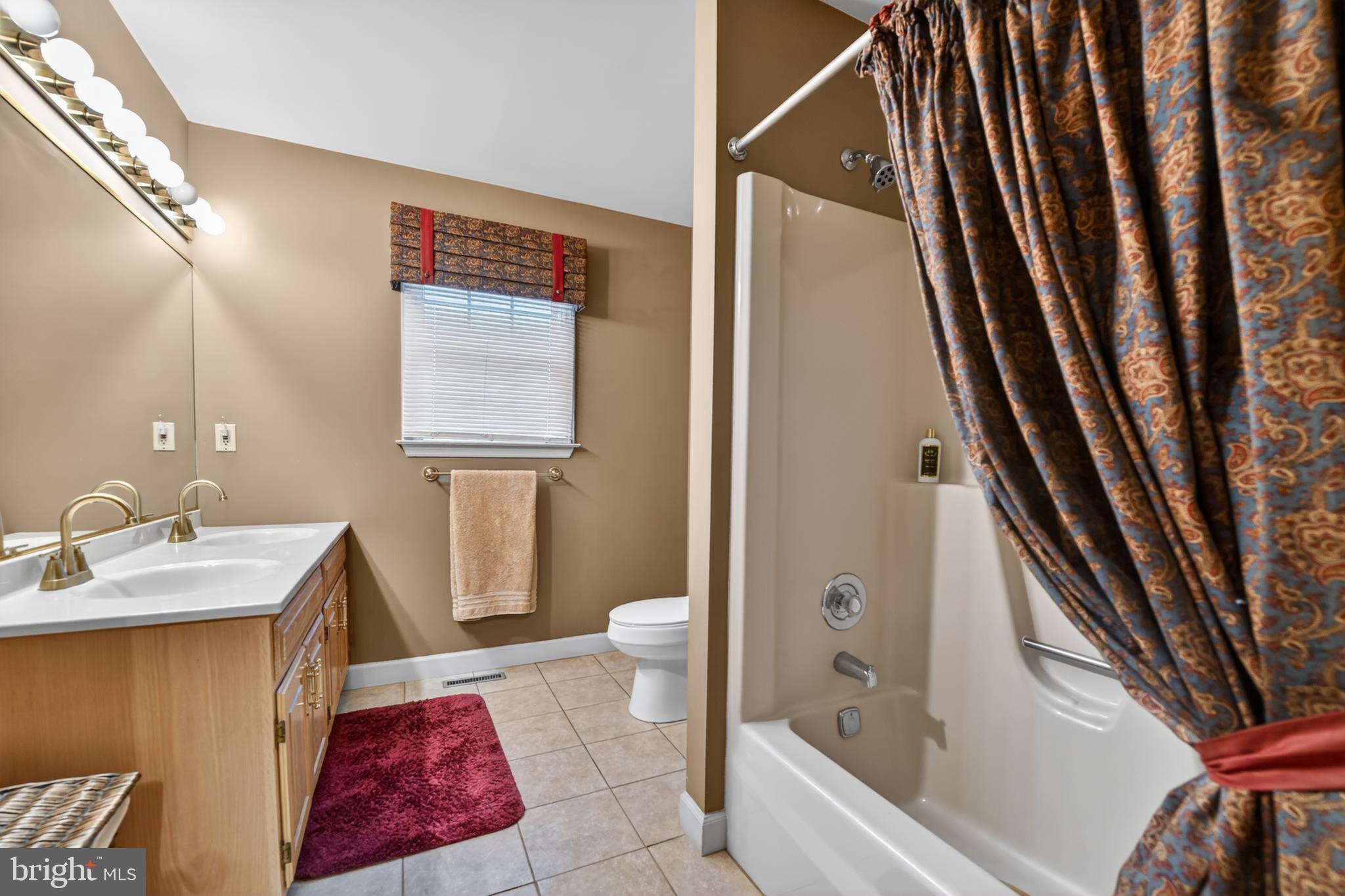 100 Deborah Drive Reading, PA 19610 - Photo 27 of 50 a bathroom with a granite countertop sink and a mirror