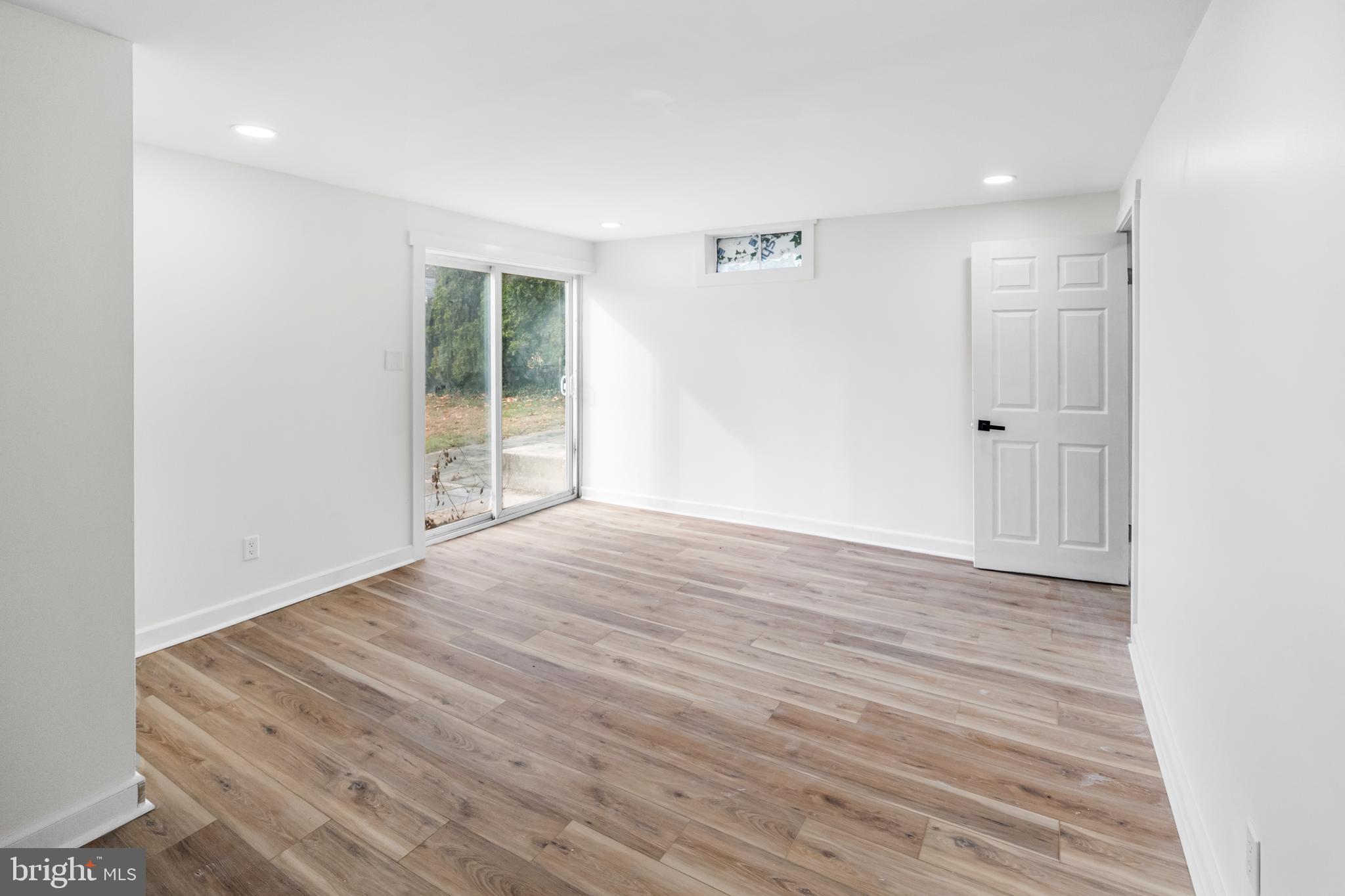 3500 Eisenbrown Road Reading, PA 19605 - Photo 22 of 34 a view of an empty room with wooden floor and a window