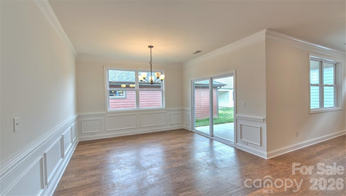 649 River Btm Road Fletcher, NC 28732 - Photo 14 of 40 wooden floor in an empty room with a window
