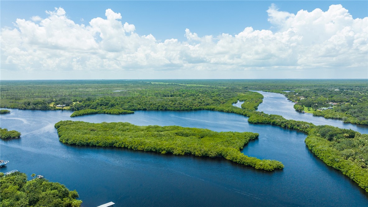 None Islands Melbourne, FL 32901 - Photo 5 of 8 an aerial view of a house with outdoor space lake view and boat