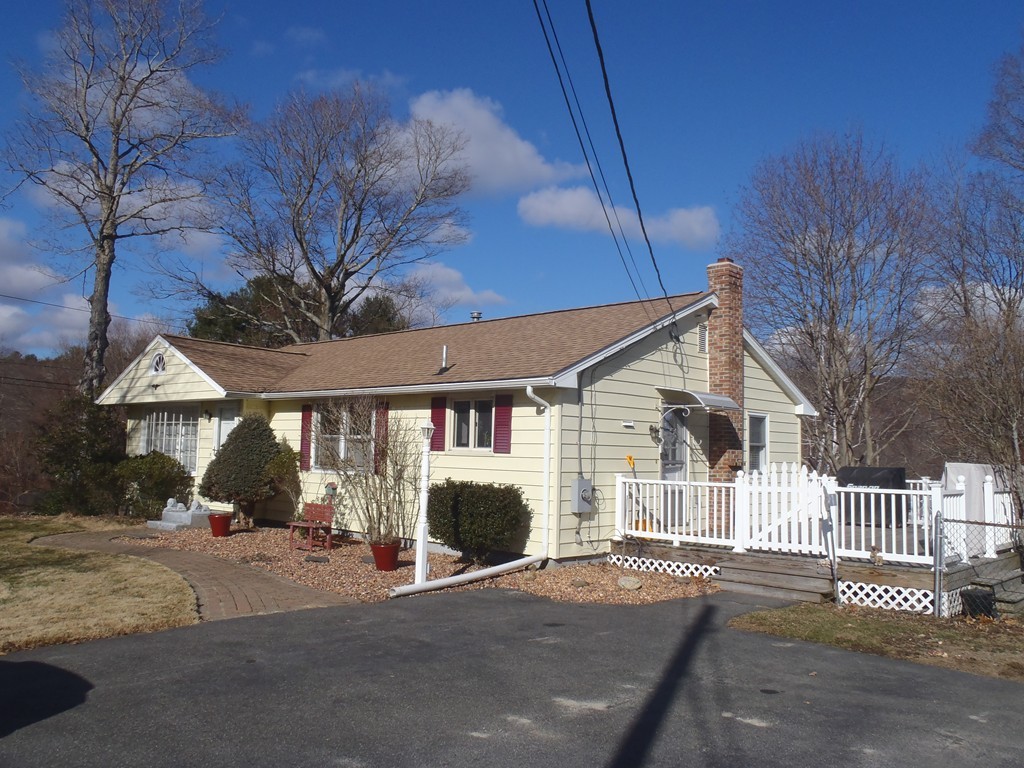 19 Wilbraham Road Monson, MA 01057 - Photo 1 of 29 a front view of a house with a yard and garage