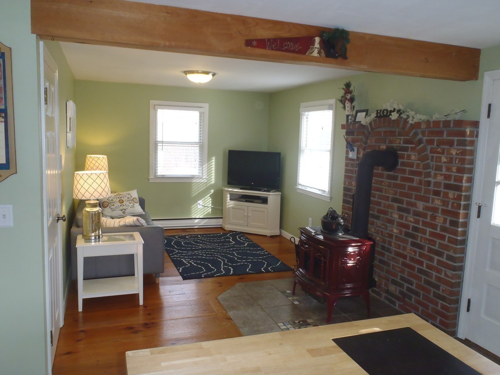 19 Wilbraham Road Monson, MA 01057 - Photo 11 of 29 a living room with furniture and a flat screen tv