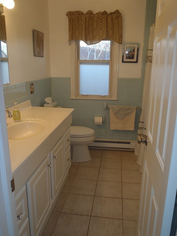 19 Wilbraham Road Monson, MA 01057 - Photo 15 of 29 a bathroom with a sink a toilet and a mirror