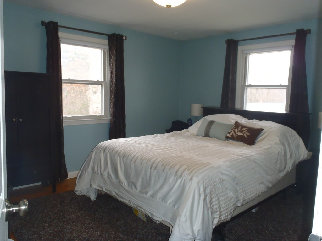 19 Wilbraham Road Monson, MA 01057 - Photo 16 of 29 a bedroom with a bed and window