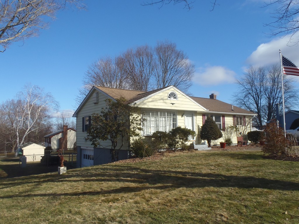 19 Wilbraham Road Monson, MA 01057 - Photo 2 of 29 a front view of a house with a yard