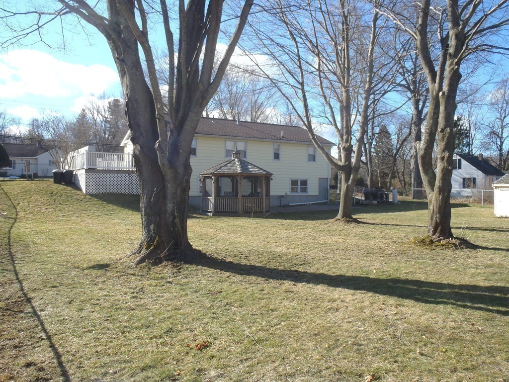 19 Wilbraham Road Monson, MA 01057 - Photo 27 of 29 a view of a yard with a house and large tree
