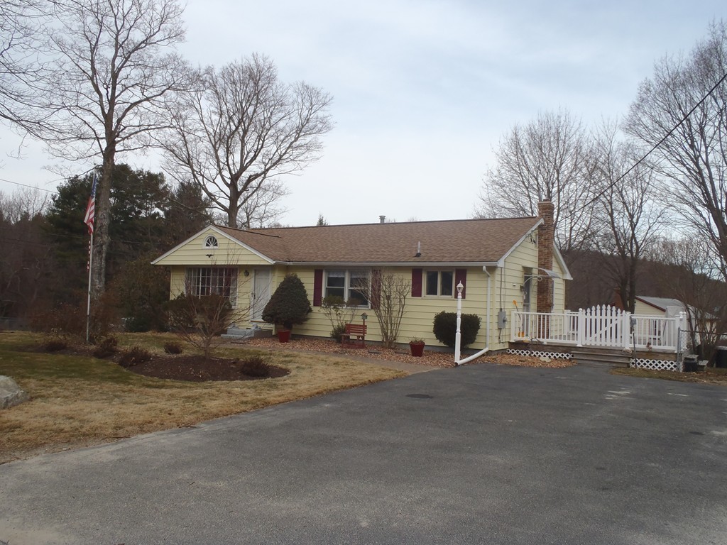 19 Wilbraham Road Monson, MA 01057 - Photo 28 of 29 a view of a house with large trees and wooden fence