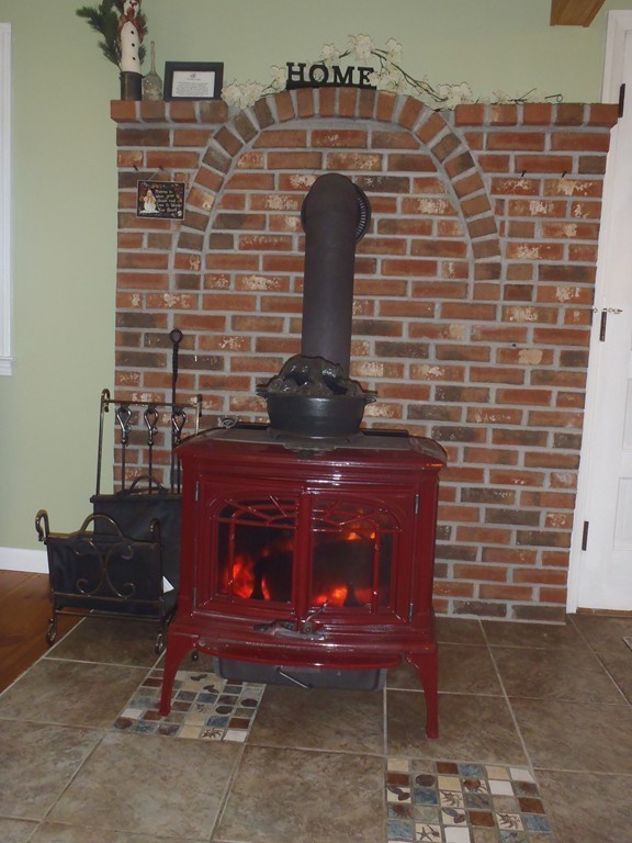 19 Wilbraham Road Monson, MA 01057 - Photo 4 of 29 a fireplace sitting in a room