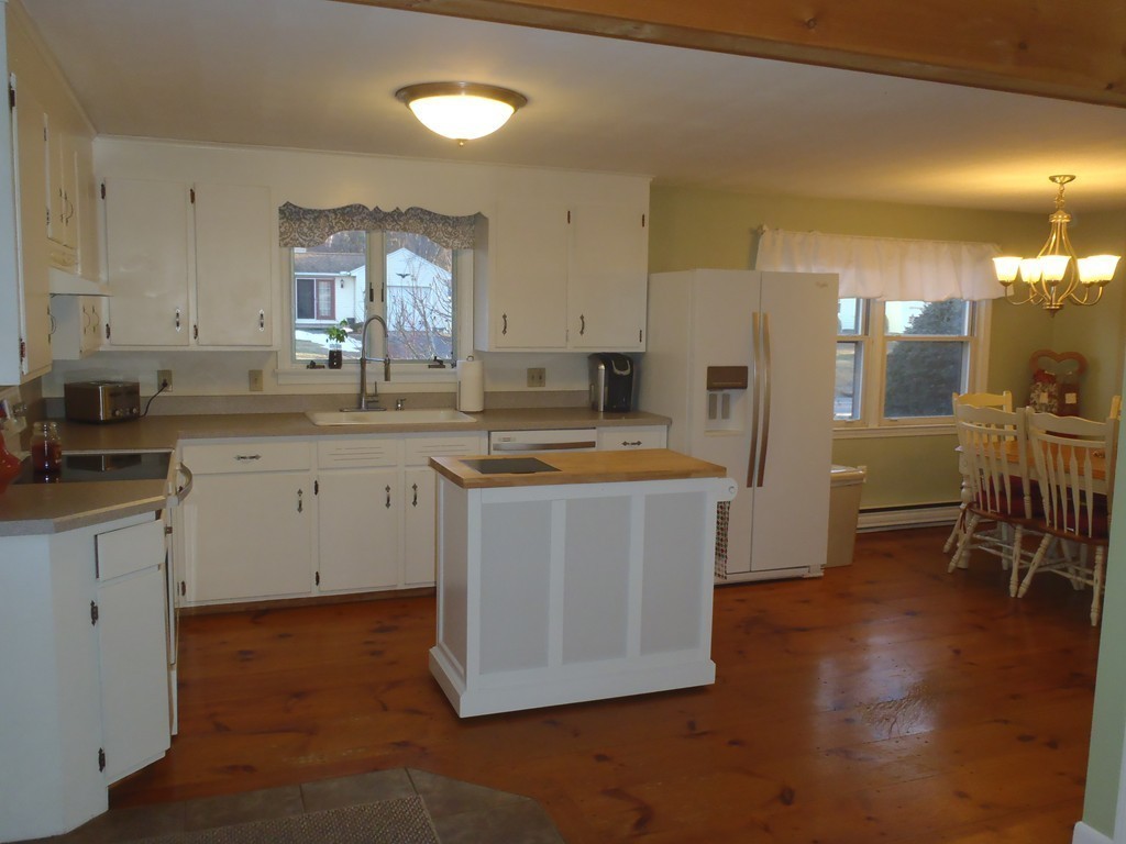19 Wilbraham Road Monson, MA 01057 - Photo 5 of 29 a kitchen with a sink cabinets and wooden floor