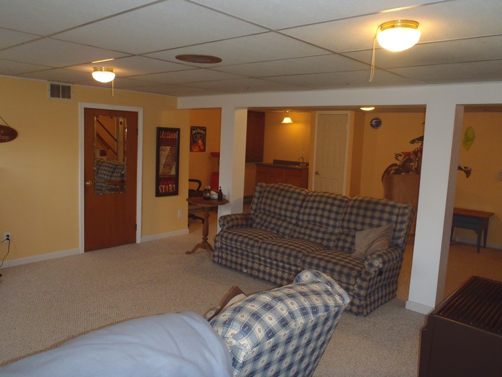 19 Wilbraham Road Monson, MA 01057 - Photo 6 of 29 a bedroom with a bed and wooden floor