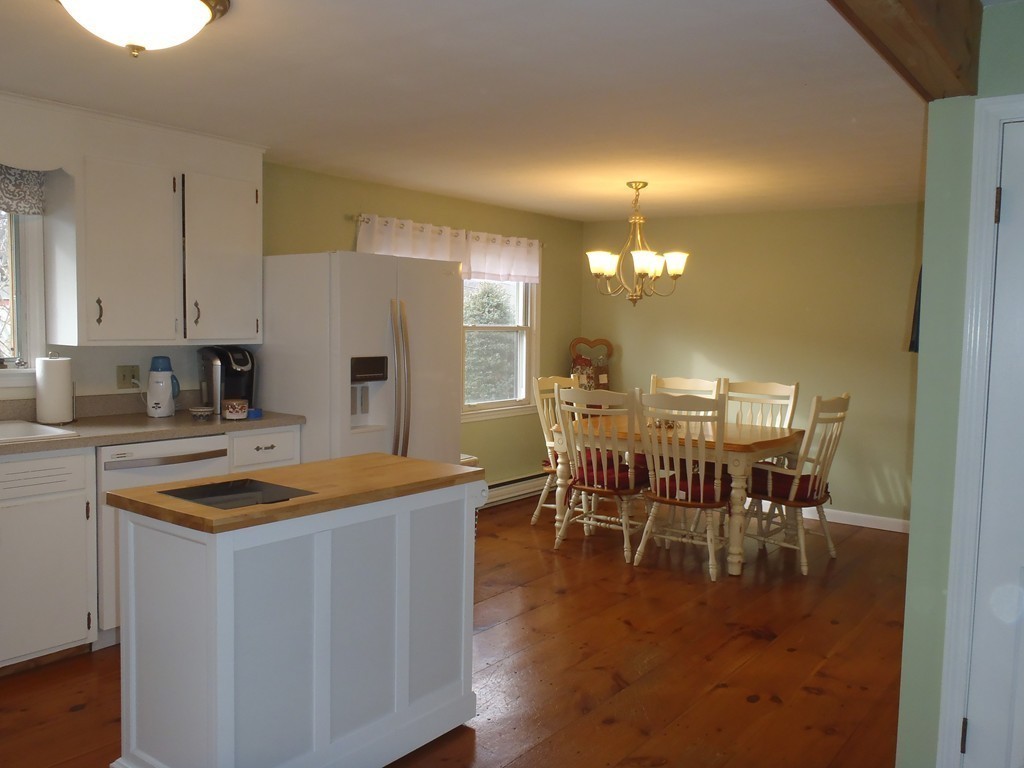 19 Wilbraham Road Monson, MA 01057 - Photo 10 of 29 a kitchen with stainless steel appliances granite countertop a dining table chairs and granite counter tops