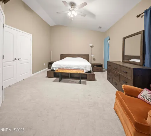 a bedroom with a bed and a table in it