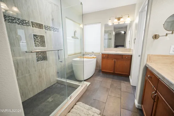 a bathroom with a bathtub and shower