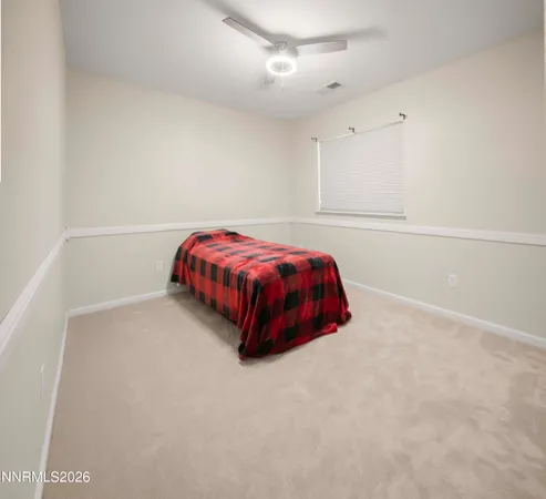 a room with a bed and window