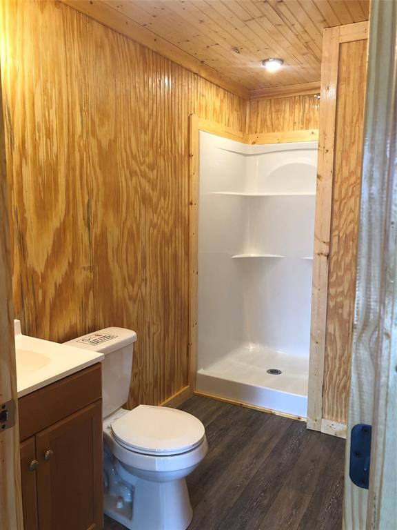 110 Pine Tree Loop, Unit B Bastrop, TX 78602 - Photo 6 of 8 a bathroom with a sink toilet and shower