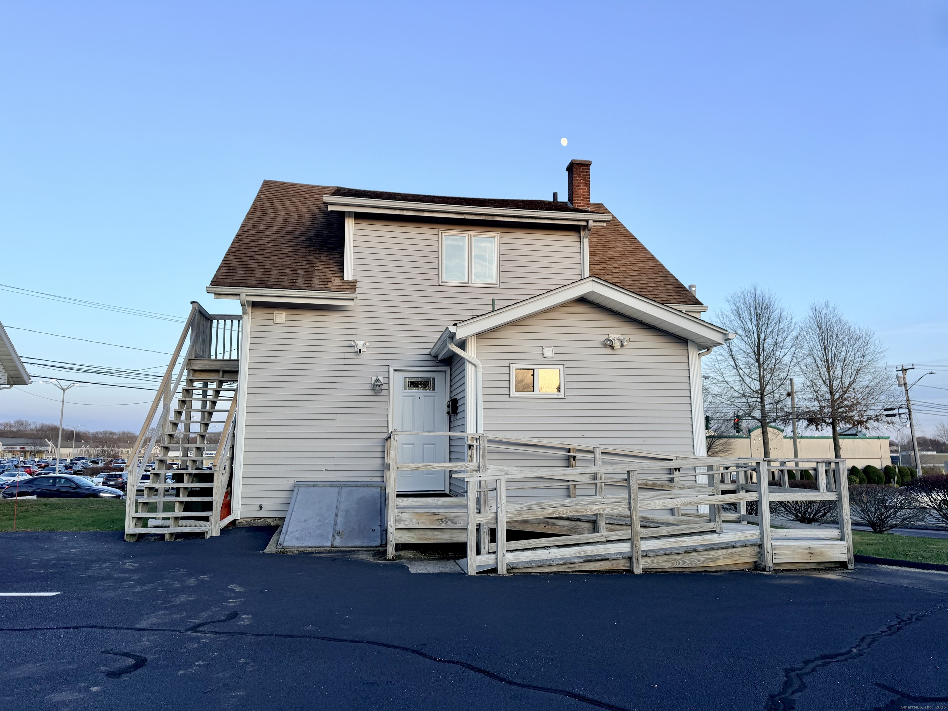 12 Clark Lane, Unit A Waterford, CT 06385 - Photo 19 of 20 a view of a house with a yard and wooden fence