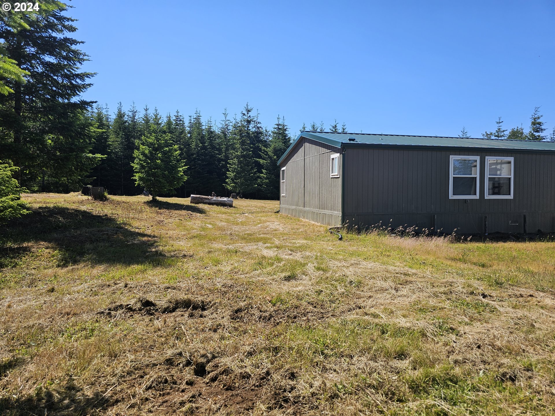 7305 Ash Street Grand Ronde, OR 97347 - Photo 34 of 47 a view of backyard of house