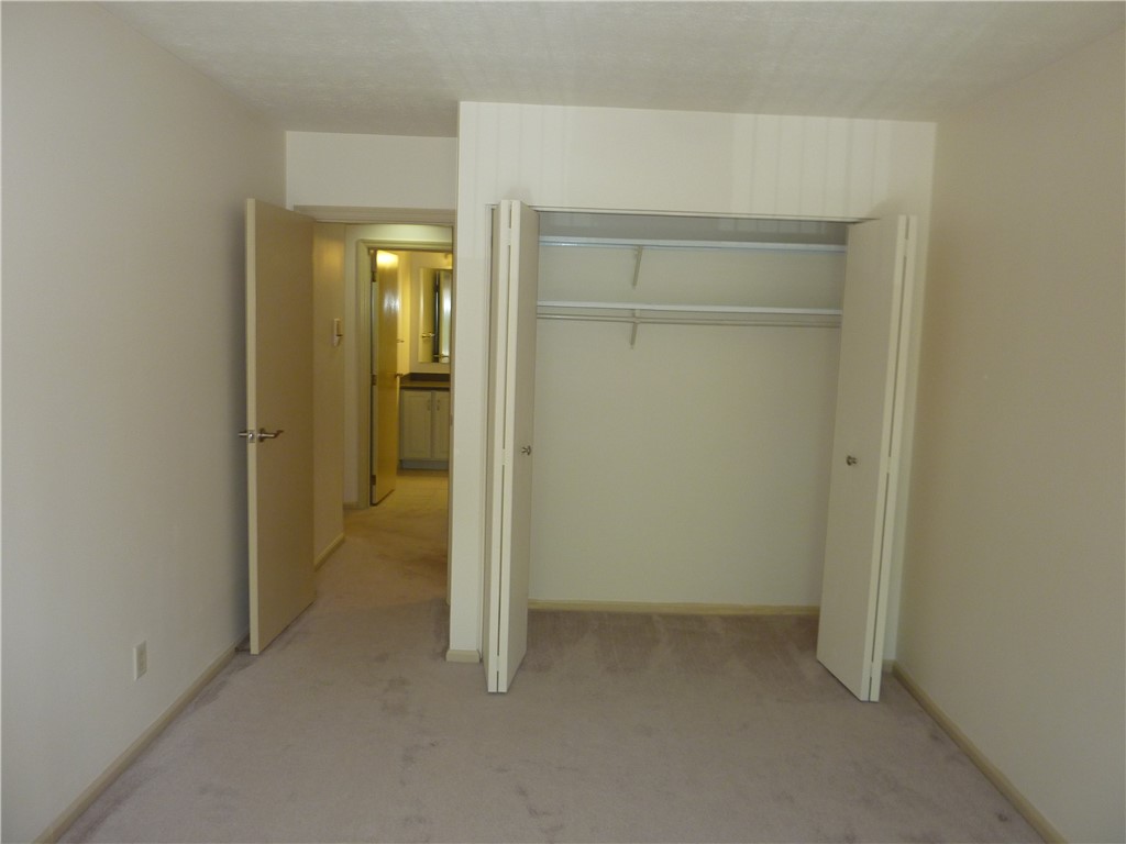 1345 Tattersall Road, Unit 64 Dayton, OH 45459 - Photo 18 of 25 This cozy bedroom features plush carpeting and a convenient closet, with an adjoining bathroom.