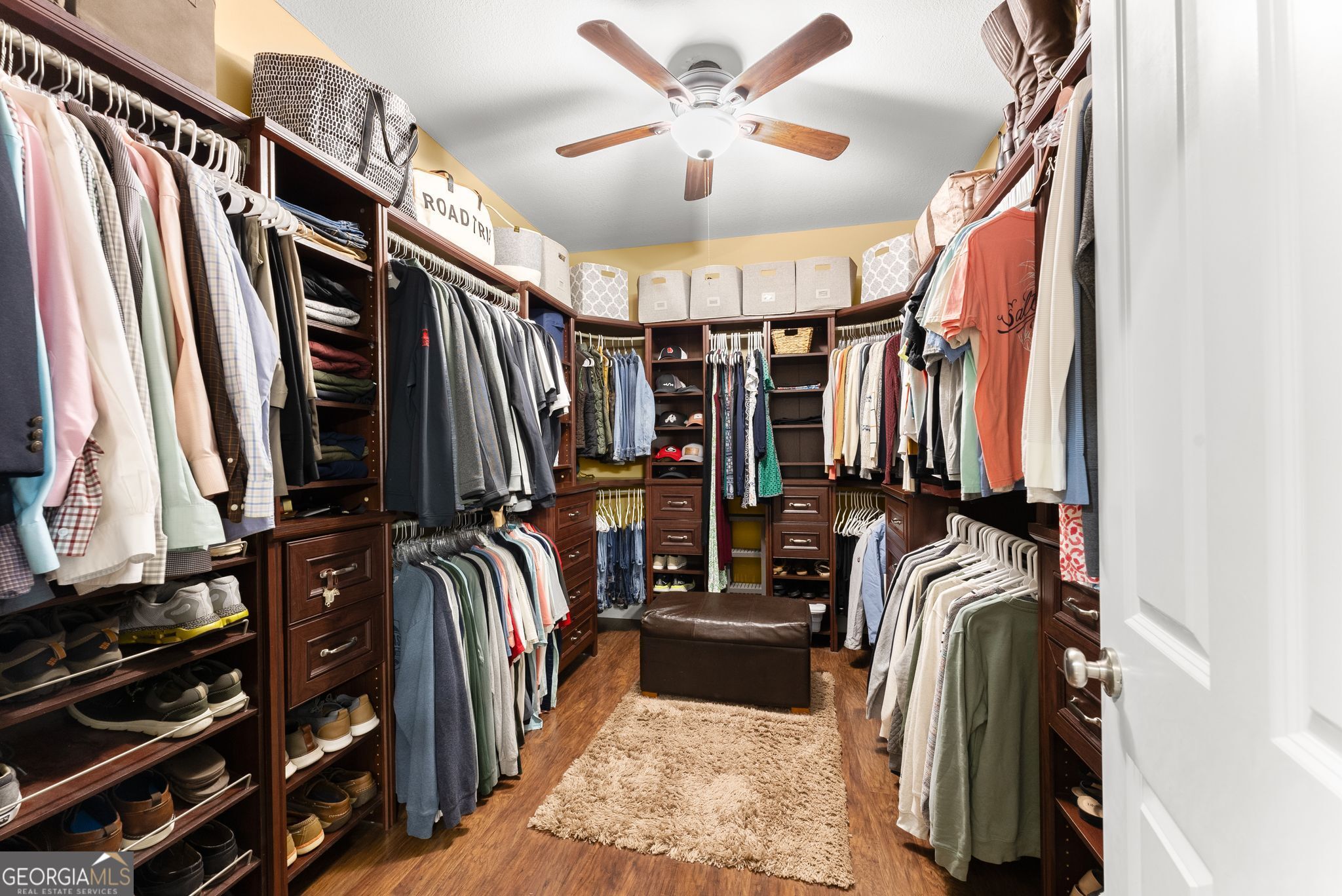 96 Magnolia Place Commerce, GA 30529 - Photo 24 of 58 a view of walk in closet with clothes and shoes