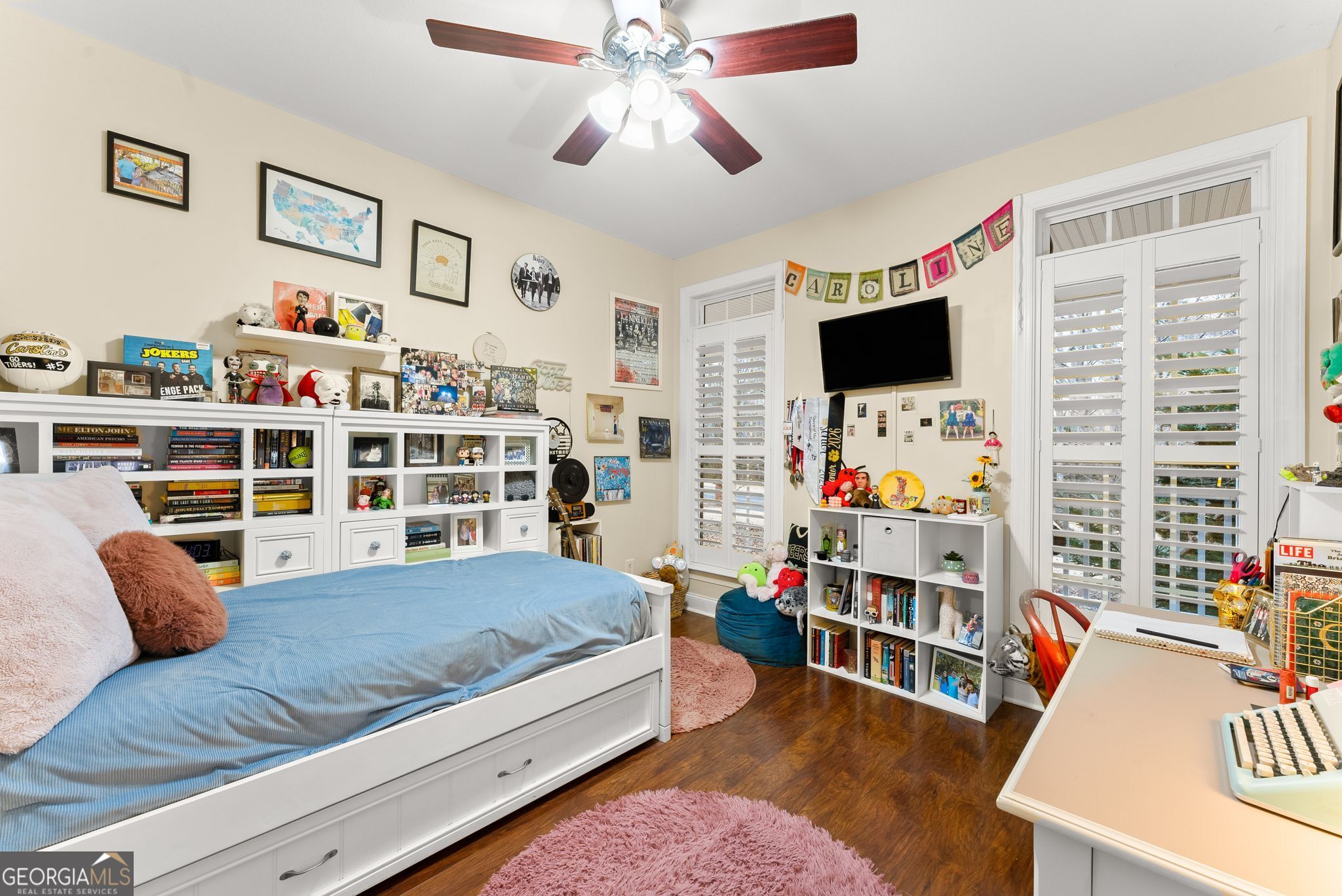 96 Magnolia Place Commerce, GA 30529 - Photo 25 of 58 a bedroom with furniture and a flat screen tv
