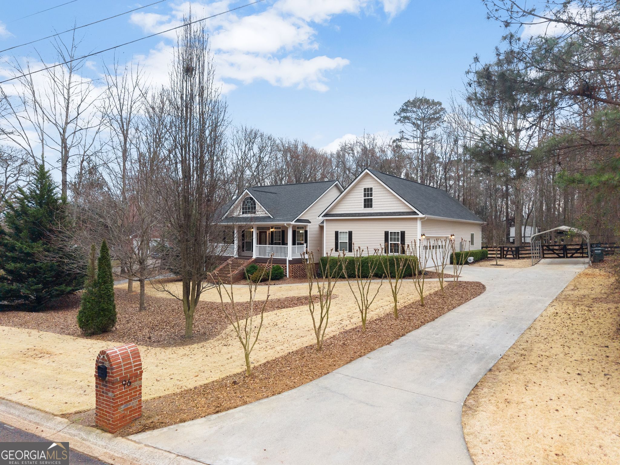 96 Magnolia Place Commerce, GA 30529 - Photo 3 of 58 a front view of a house with a yard and garage