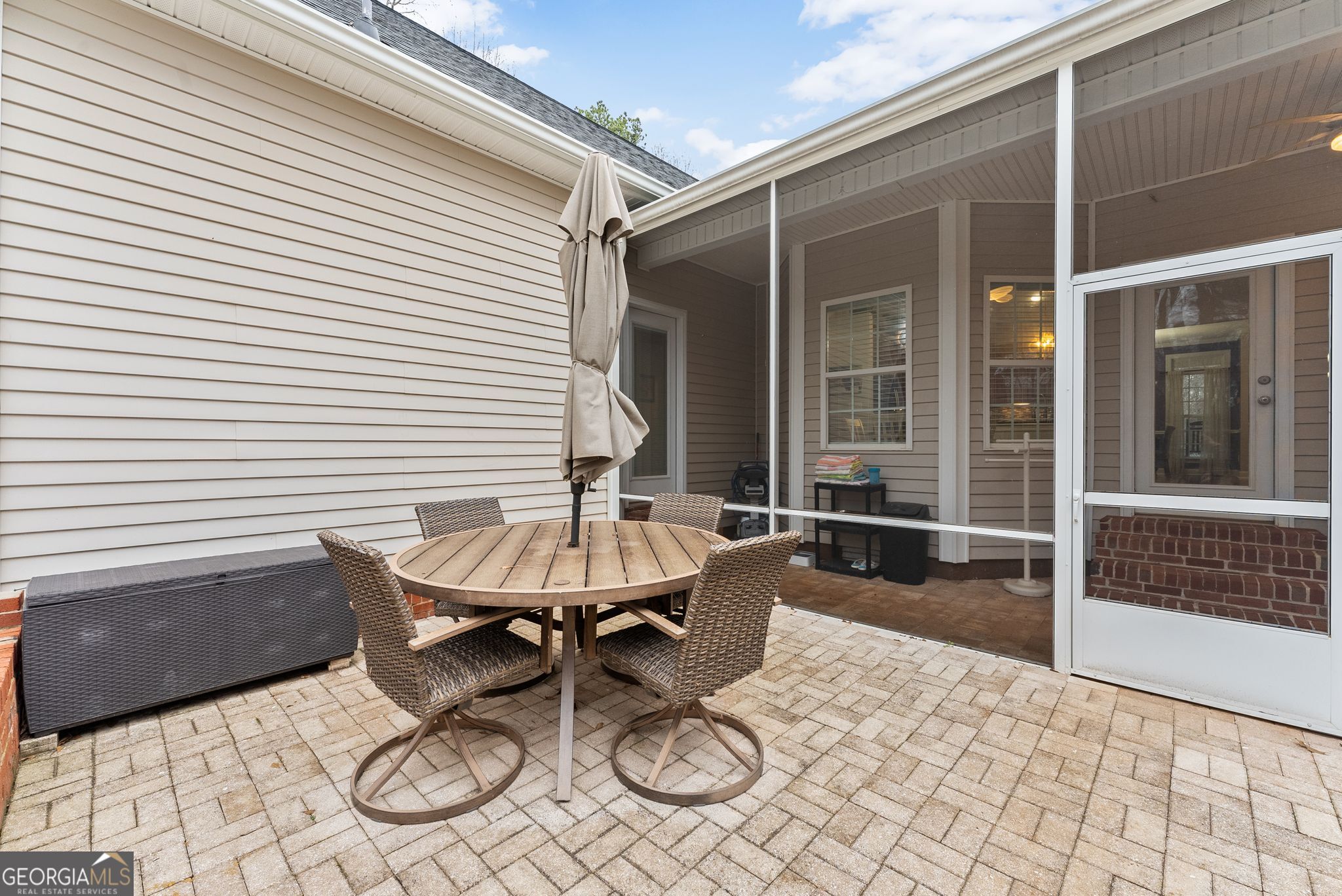 96 Magnolia Place Commerce, GA 30529 - Photo 35 of 58 a view of a patio with table and chairs and wooden floor