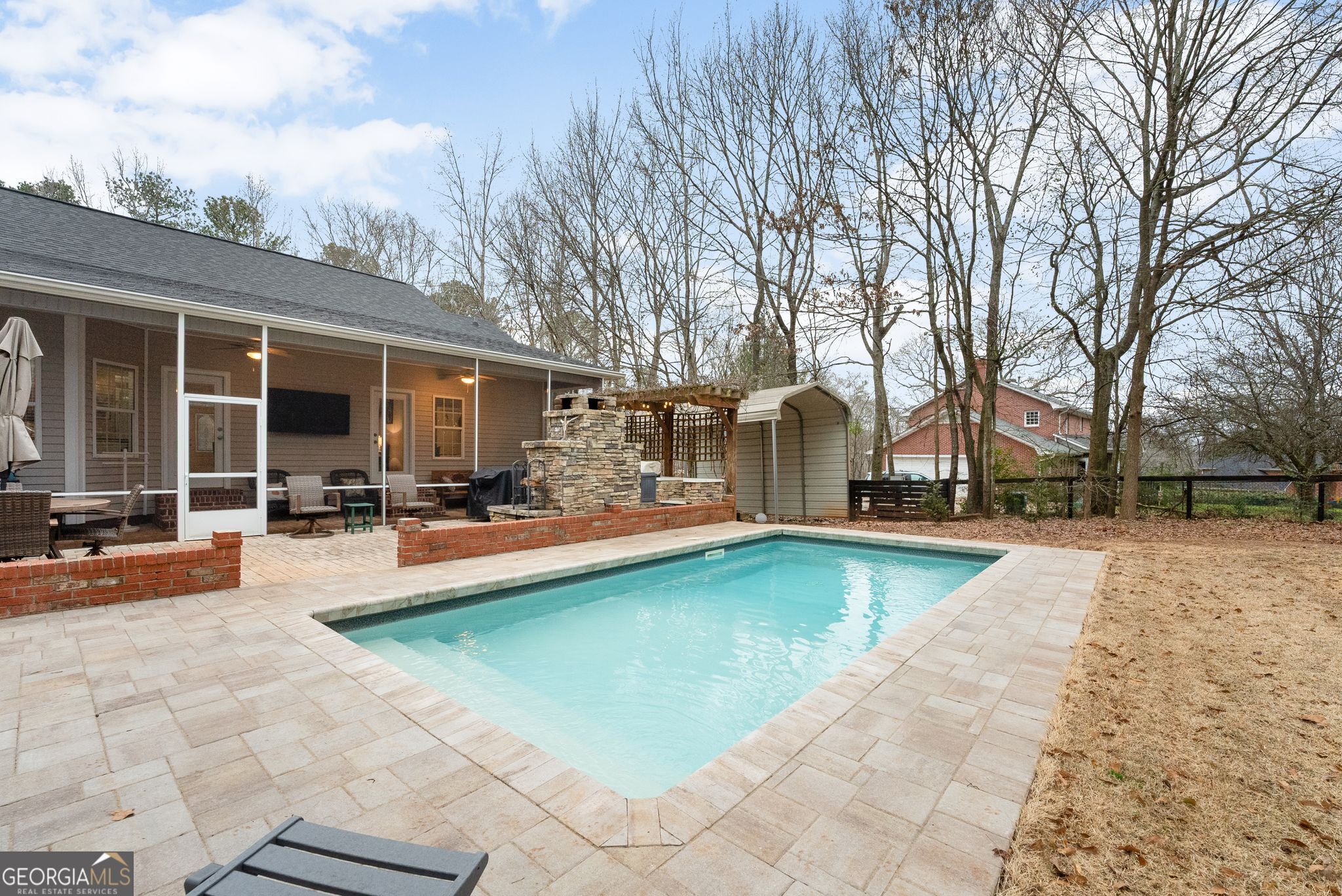 96 Magnolia Place Commerce, GA 30529 - Photo 40 of 58 a view of a patio with swimming pool table and chairs