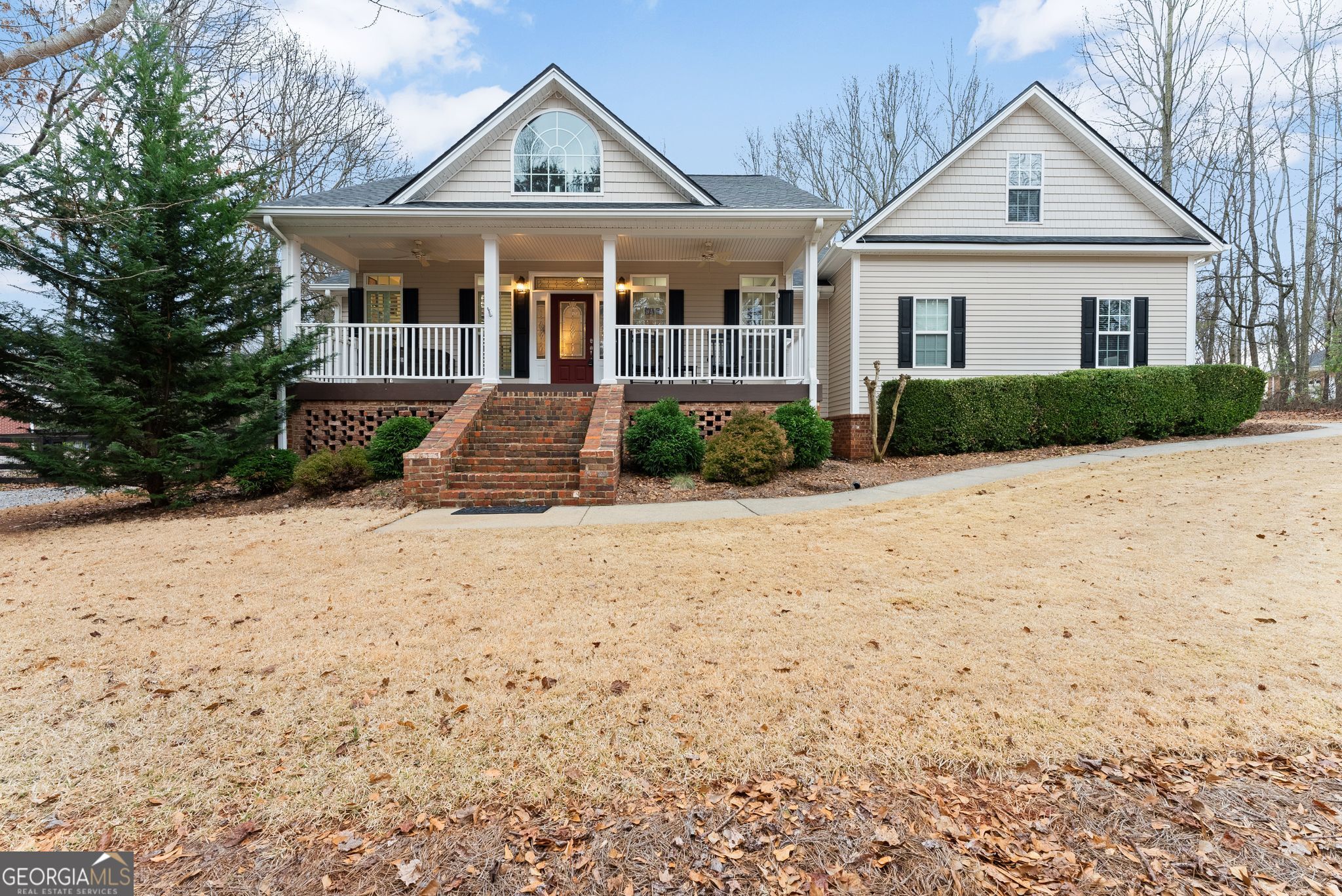 96 Magnolia Place Commerce, GA 30529 - Photo 4 of 58 a front view of a house with a yard