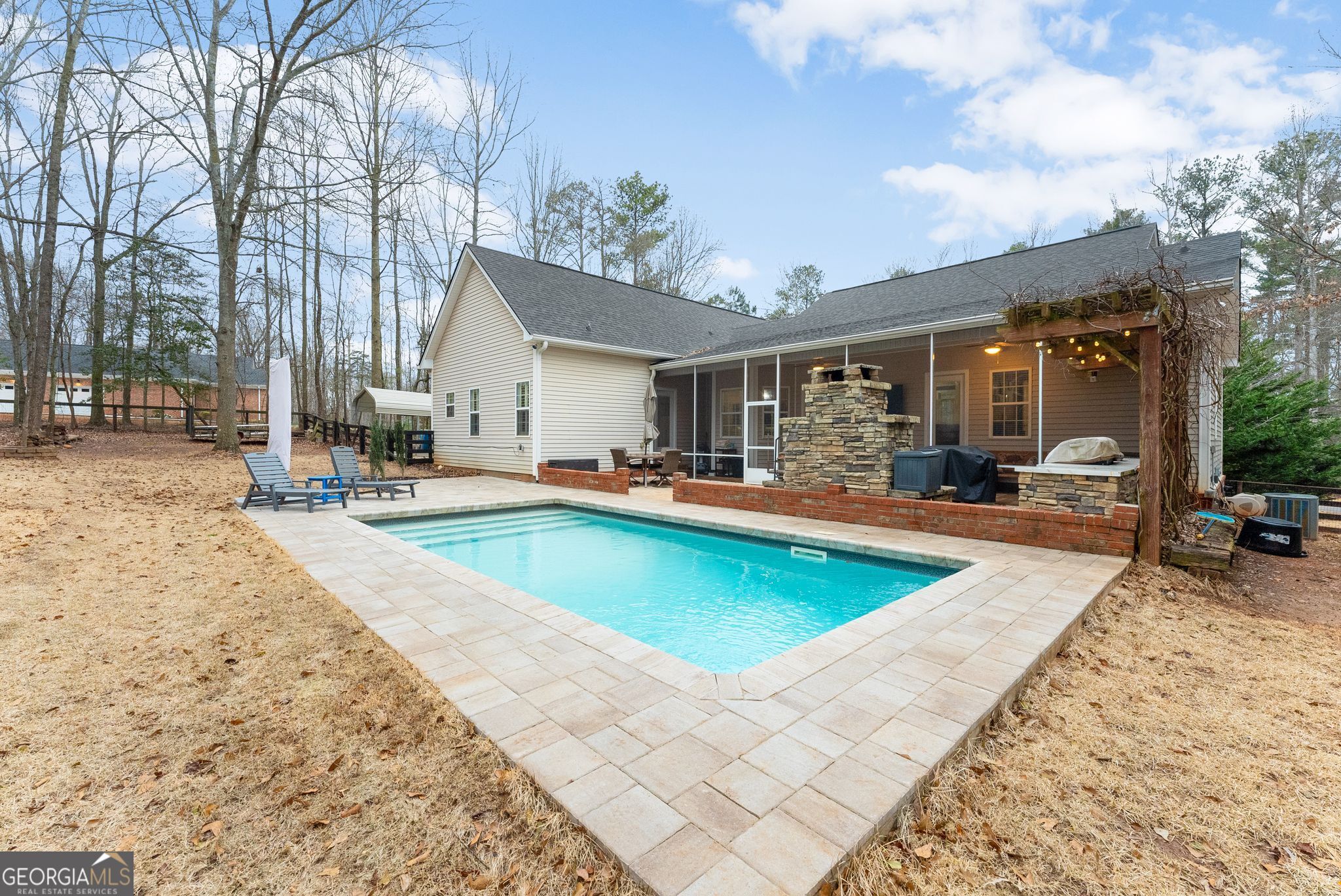 96 Magnolia Place Commerce, GA 30529 - Photo 41 of 58 a view of a patio with swimming pool table and chairs