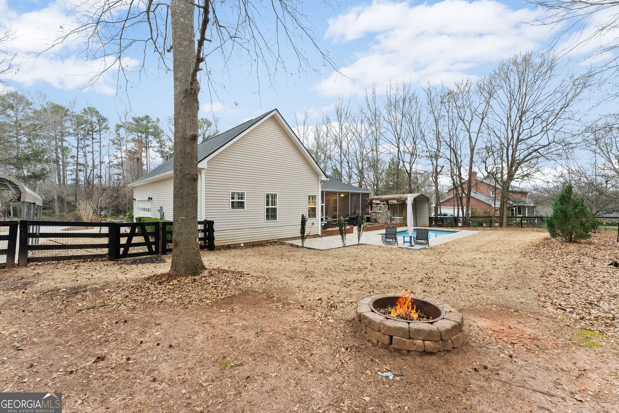 96 Magnolia Place Commerce, GA 30529 - Photo 47 of 58 a view of a backyard with a large tree
