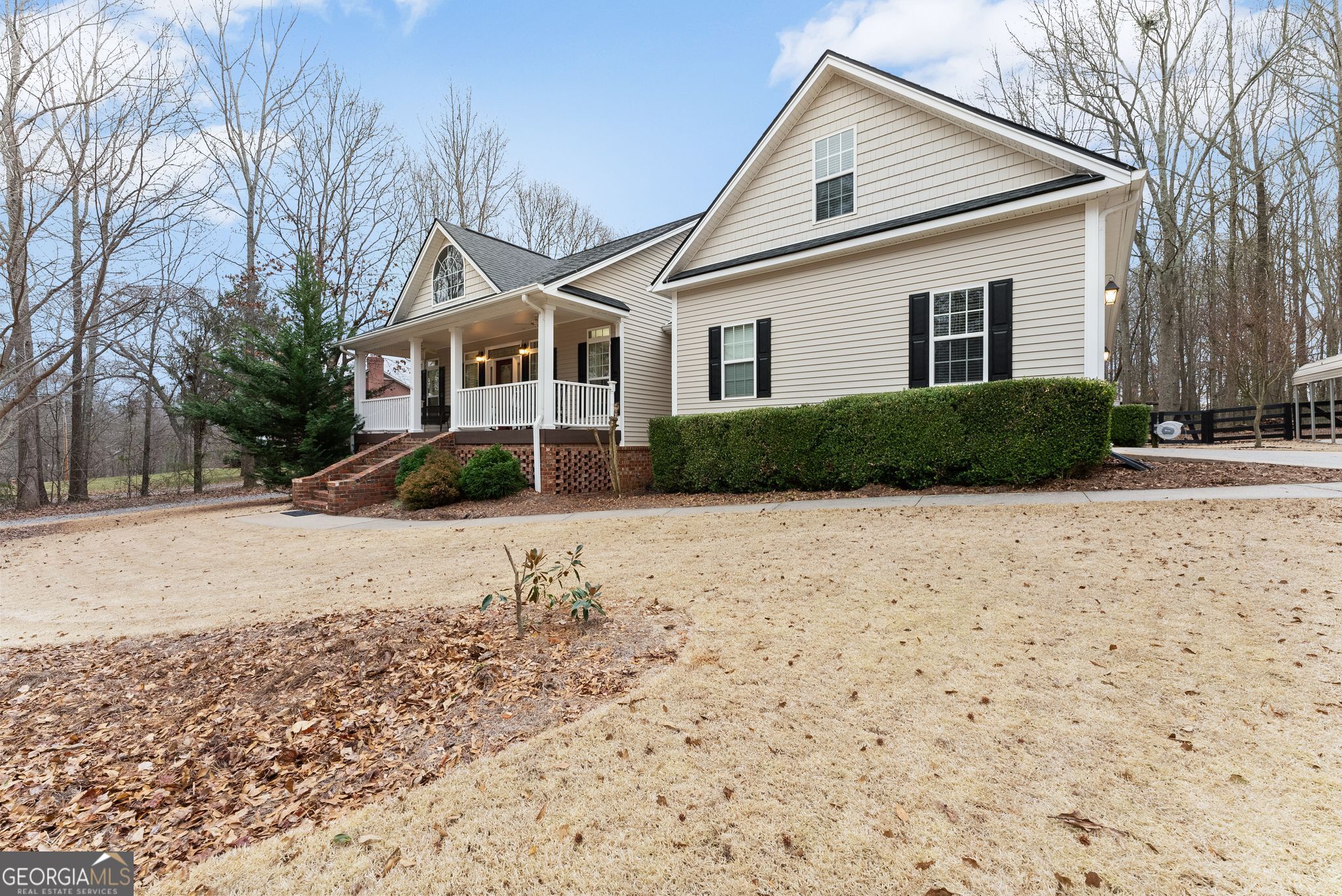 96 Magnolia Place Commerce, GA 30529 - Photo 6 of 58 a front view of a house with a yard covered in snow
