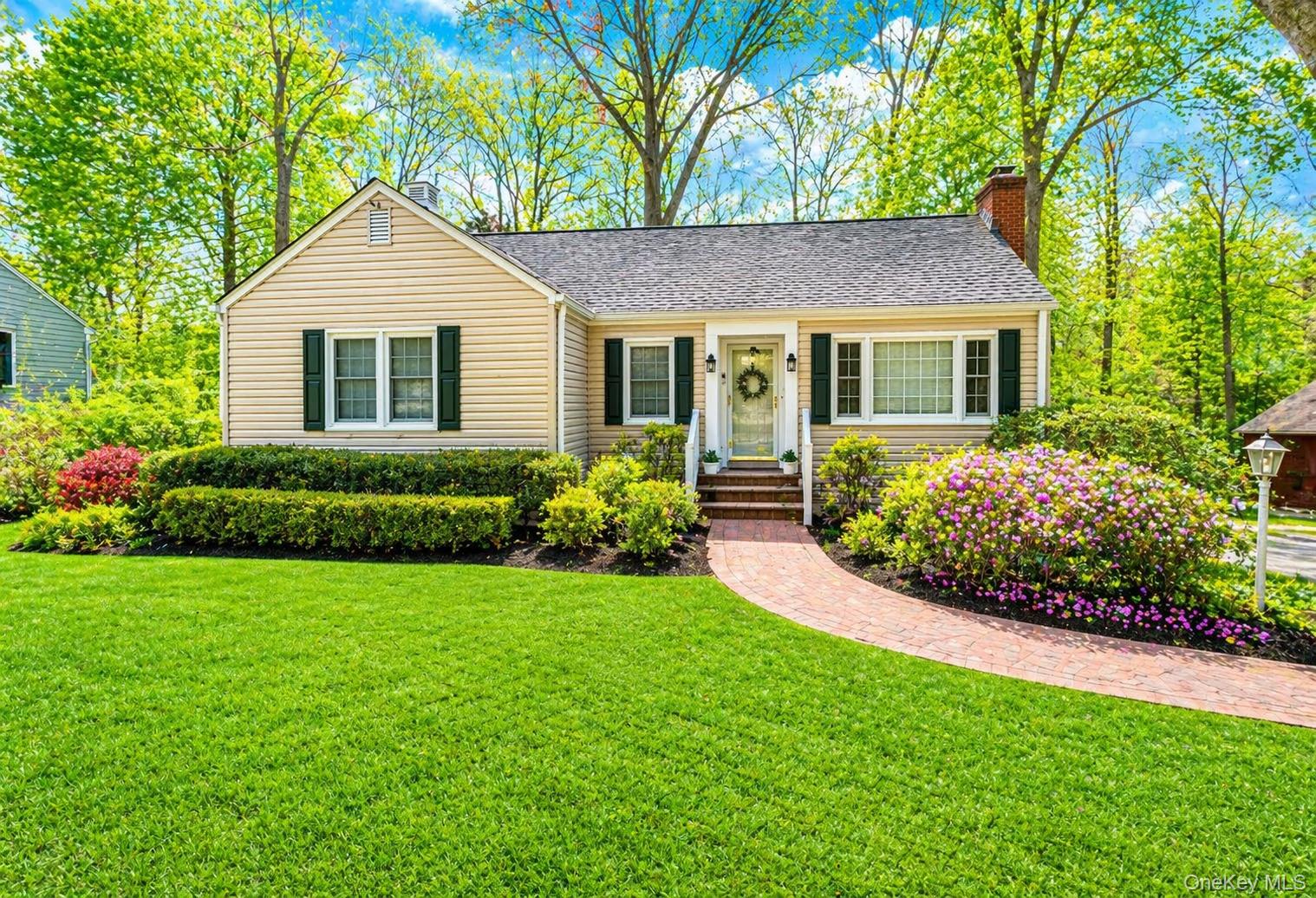 6 Huyler Road Setauket, NY 11733 - Photo 1 of 27 a front view of a house with a garden