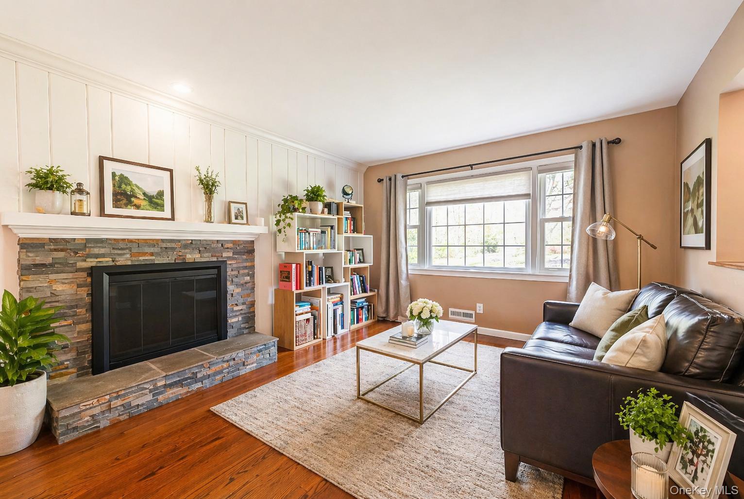 6 Huyler Road Setauket, NY 11733 - Photo 11 of 27 a living room with furniture and a fireplace