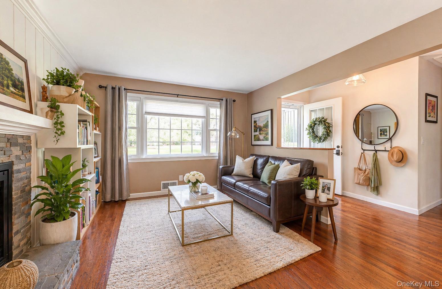 6 Huyler Road Setauket, NY 11733 - Photo 12 of 27 a living room with furniture a rug potted plant and a window