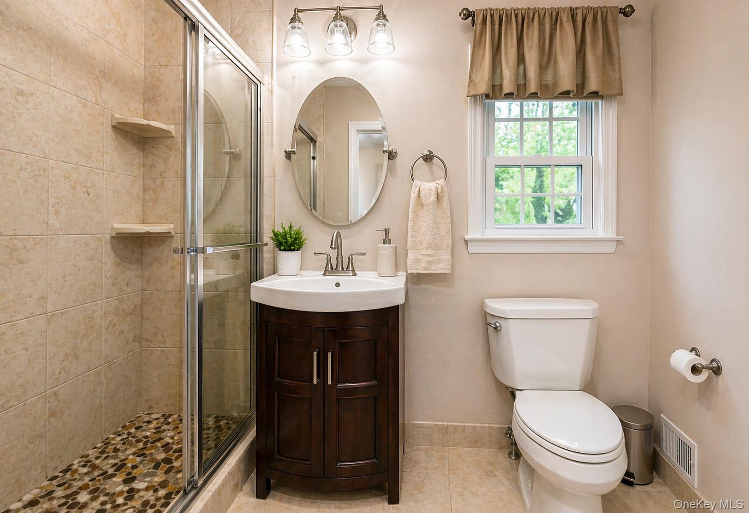 6 Huyler Road Setauket, NY 11733 - Photo 18 of 27 a bathroom with a toilet sink and mirror