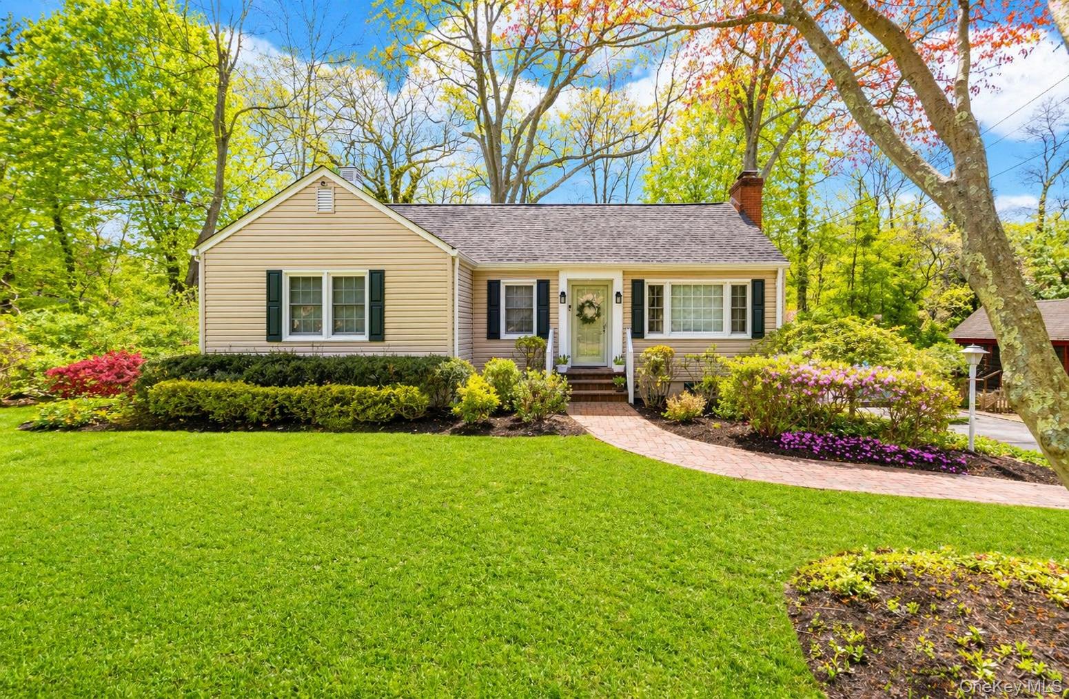 6 Huyler Road Setauket, NY 11733 - Photo 2 of 27 a front view of a house with garden