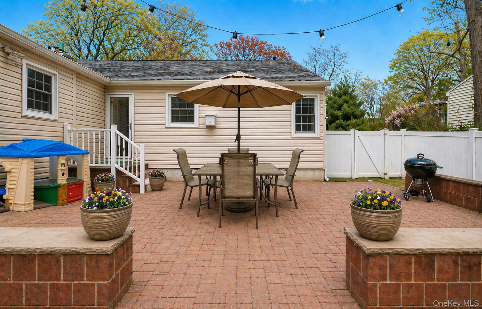 6 Huyler Road Setauket, NY 11733 - Photo 22 of 27 a view of a tables and chairs in patio