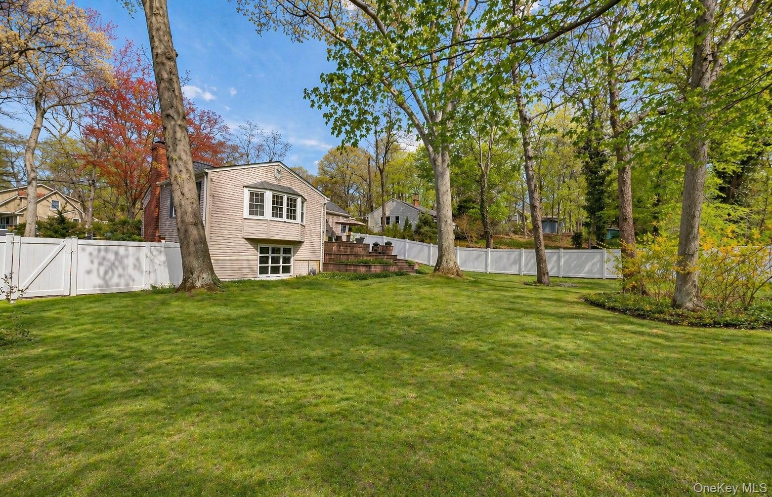 6 Huyler Road Setauket, NY 11733 - Photo 25 of 27 a view of a house with a big yard and large trees