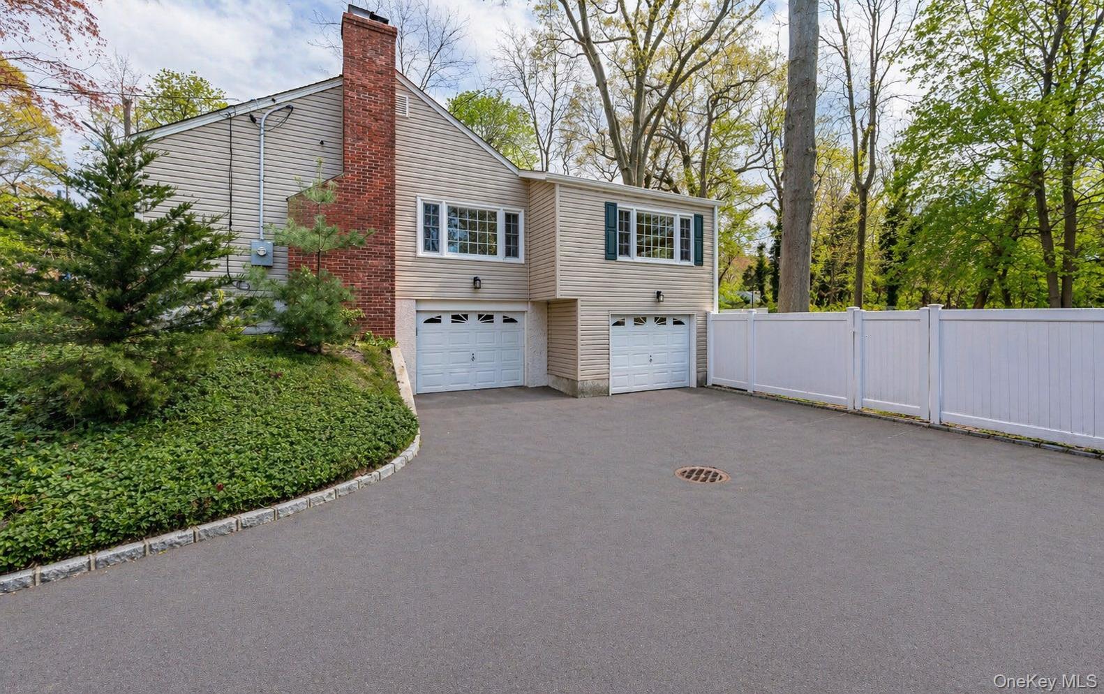 6 Huyler Road Setauket, NY 11733 - Photo 27 of 27 front view of a house with a yard