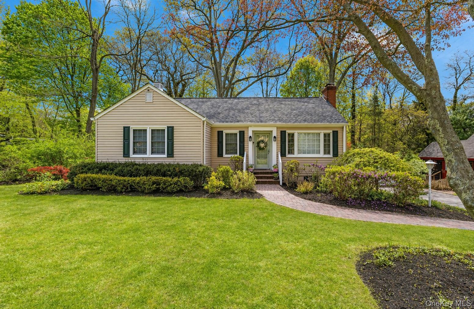 6 Huyler Road Setauket, NY 11733 - Photo 3 of 27 a front view of a house with a garden