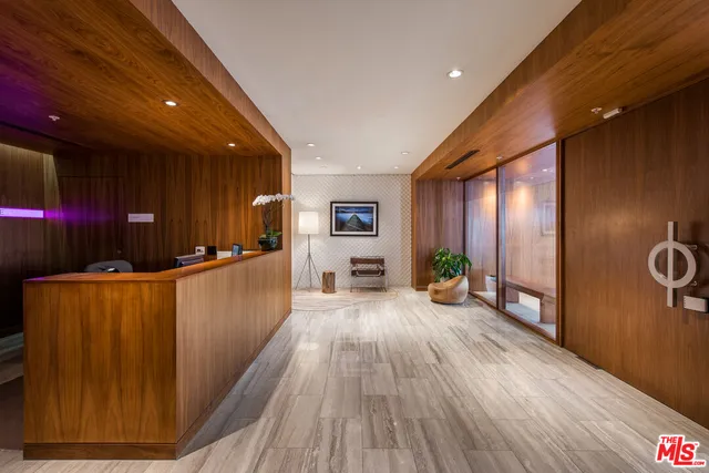 a view of a living room hardwood floor and a kitchen