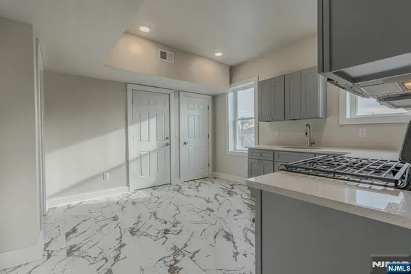 a kitchen with a stove a refrigerator and a stove