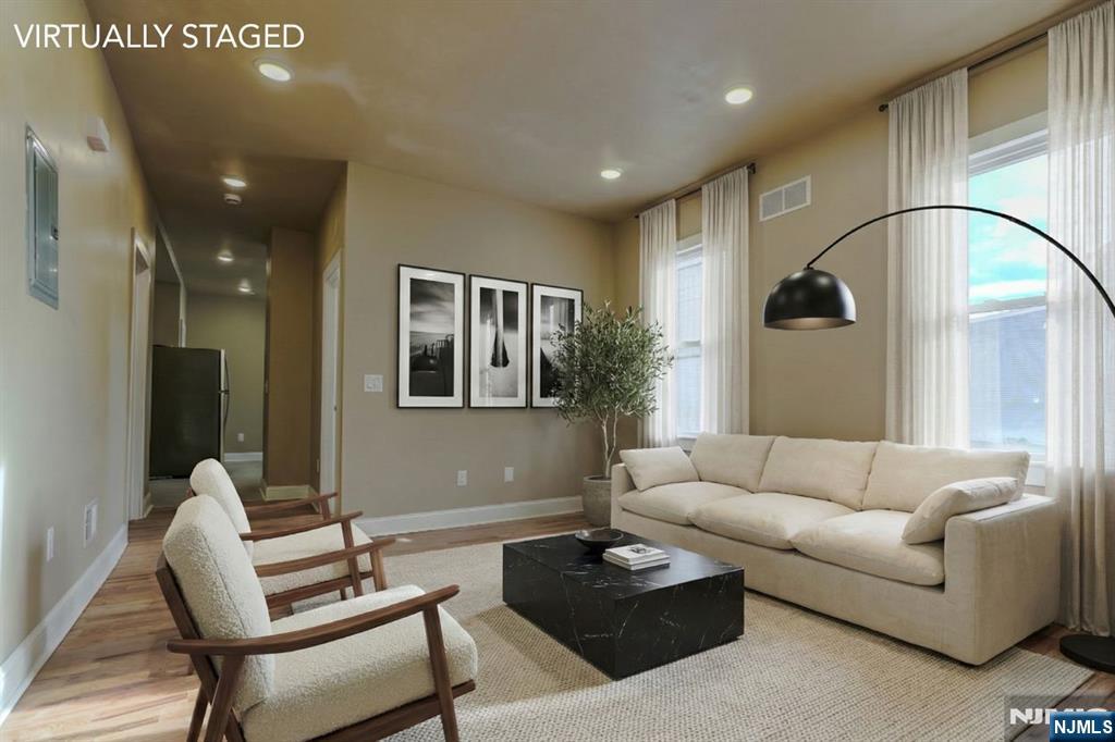 882 South 14th Street, Unit 2 Newark, NJ 07108 - Photo 13 of 18 a living room with furniture