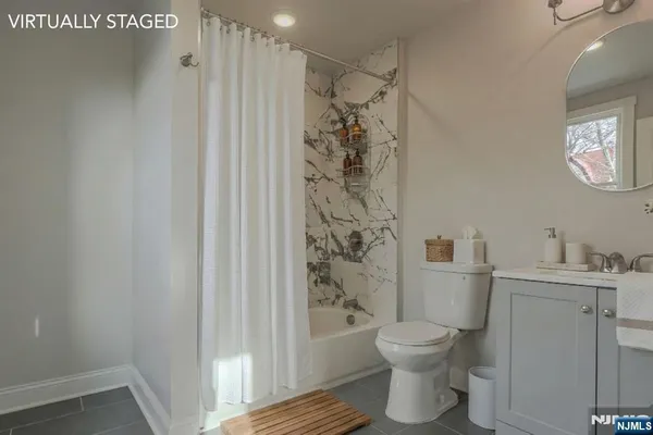 a bathroom with a toilet a sink and shower