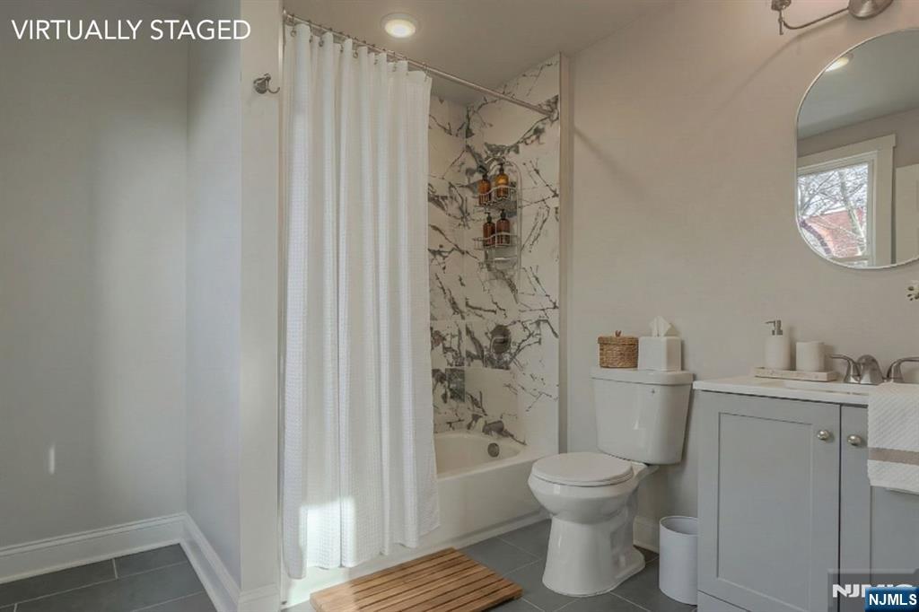 882 South 14th Street, Unit 2 Newark, NJ 07108 - Photo 4 of 18 a bathroom with a toilet a sink and shower